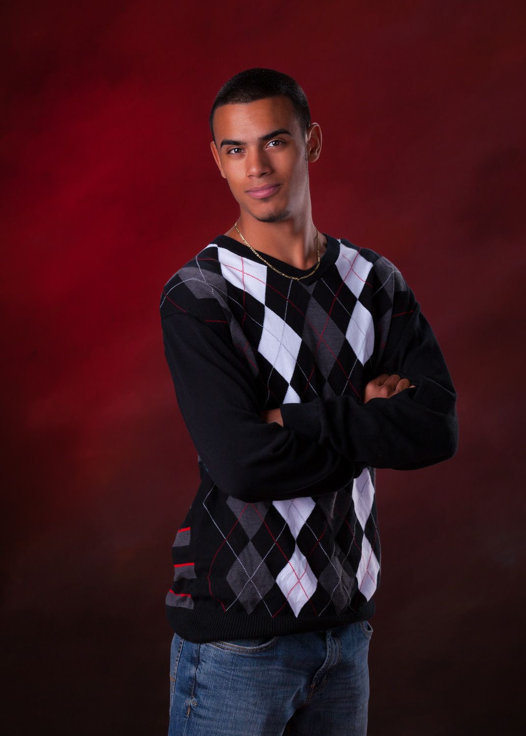 Young man against red background