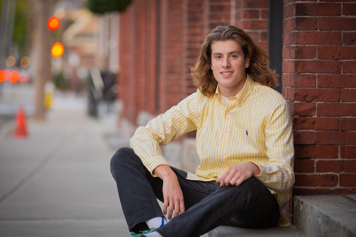 Young man on a city sidewalk