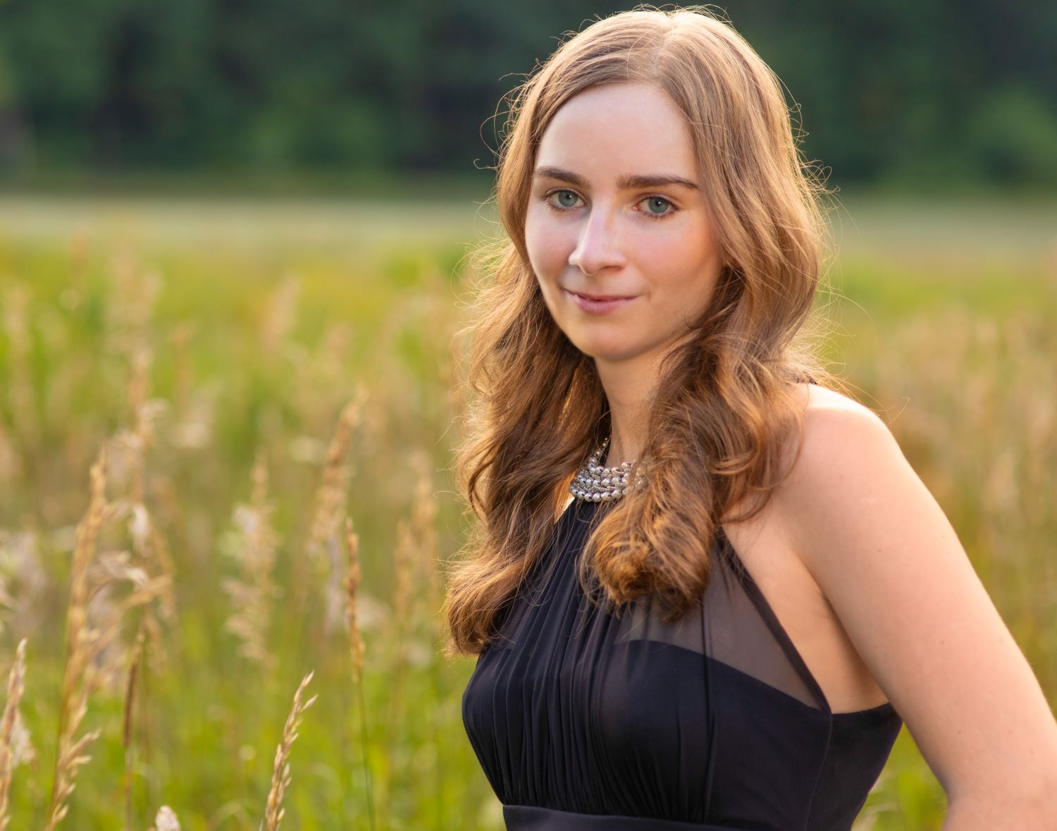 Young woman in green field