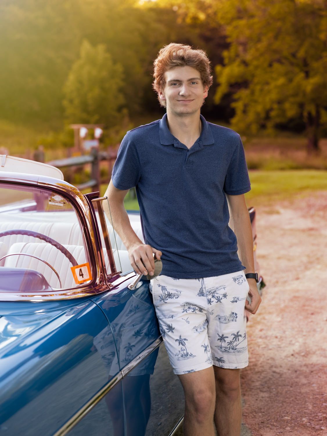 Young man with classic car